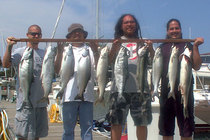 Friends Eric and crew with Coho and King Salmon.